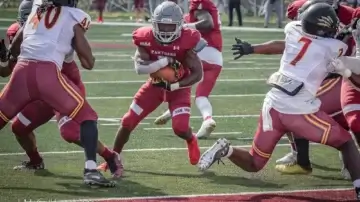 Football players in action on the field.