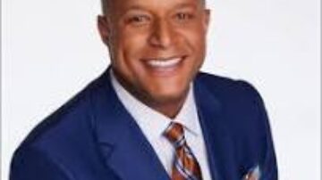 Craigs Melvin Smiling man in blue suit and striped tie.@tik4tat