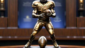 Bronze football player trophy in museum display.